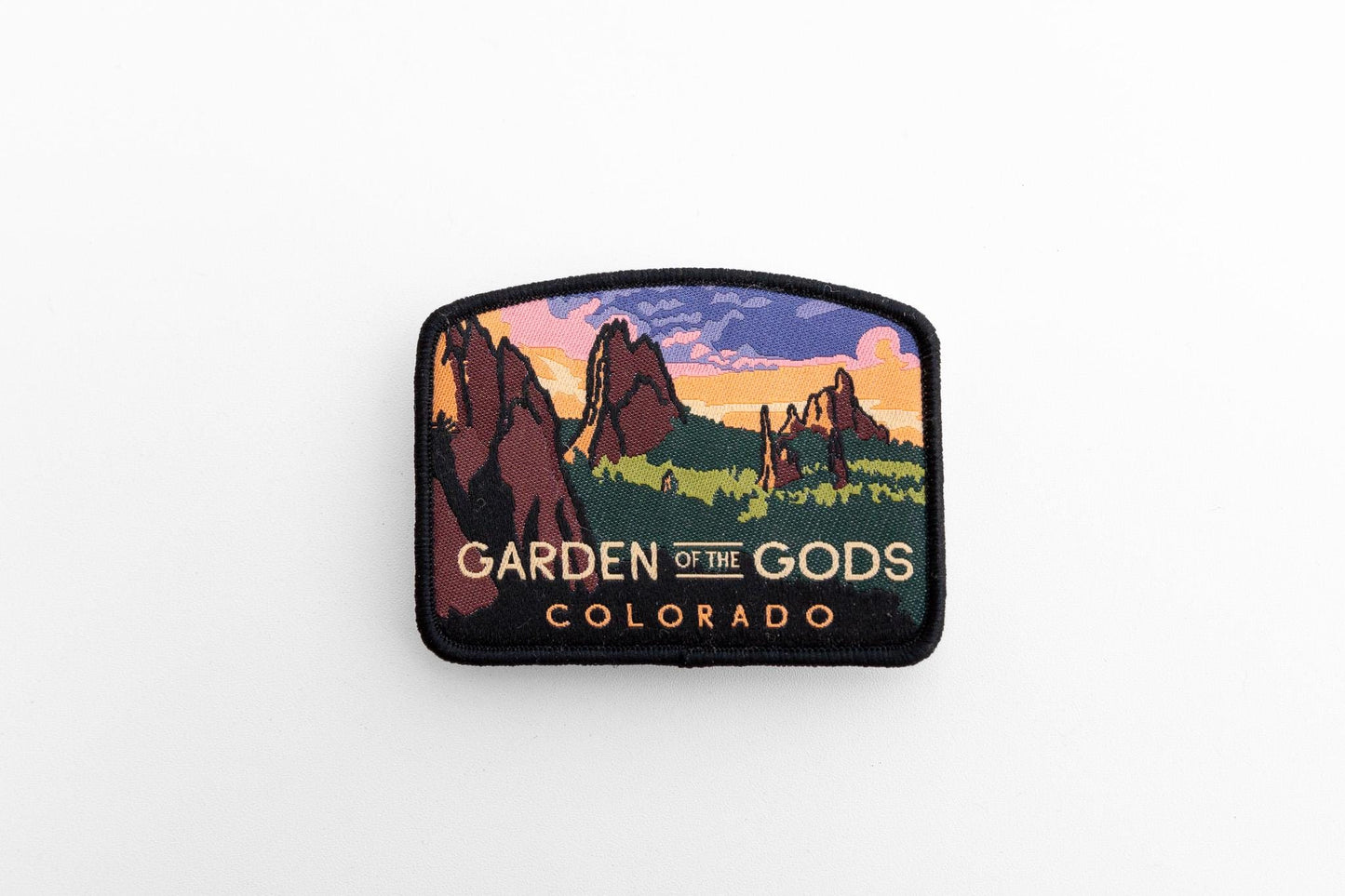 Wider white background framing, with the Garden of the Gods Colorado patch angled to show its black merrowed edge.