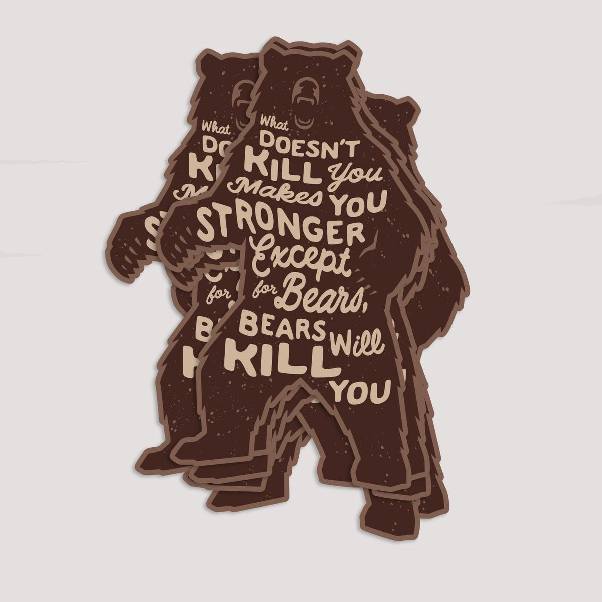 Several Bears Will Kill You stickers fanned in a stack on a pale grey surface.