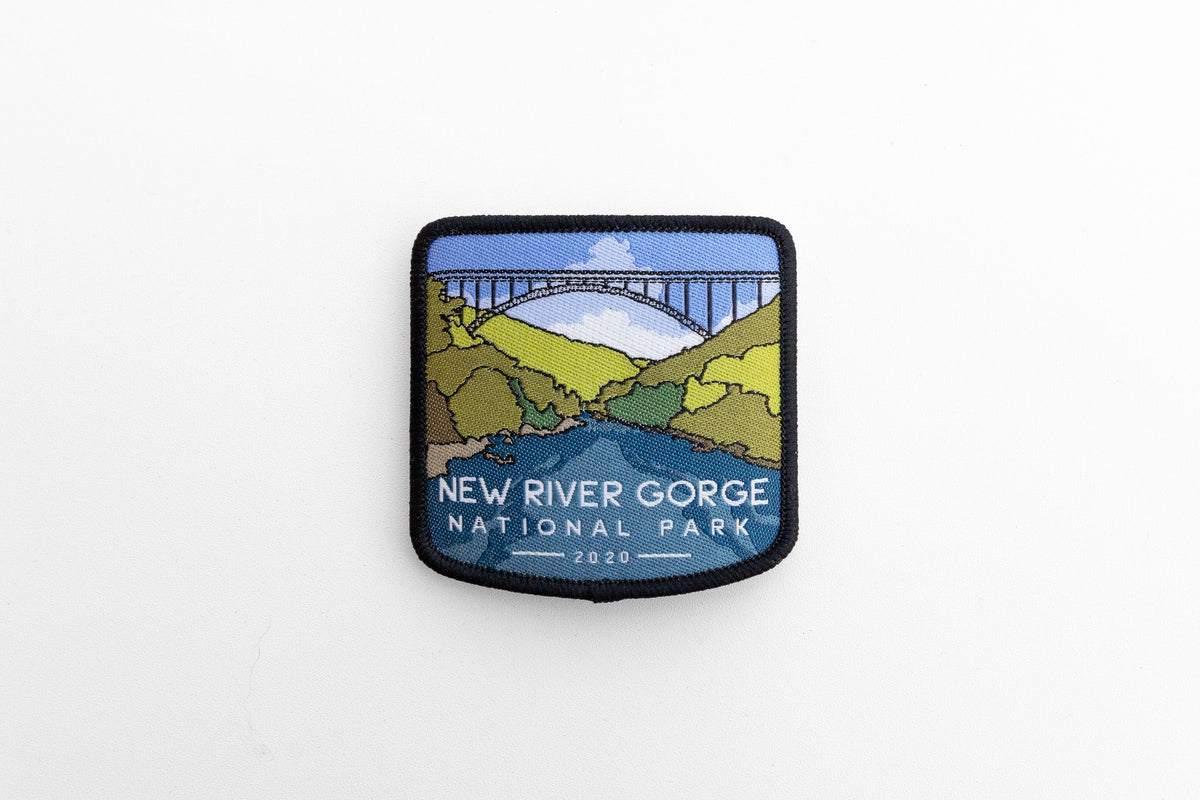 Shot from farther back, the New River Gorge National Park patch sits small and centered on a plain white surface.