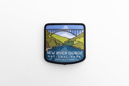 Shot from farther back, the New River Gorge National Park patch sits small and centered on a plain white surface.