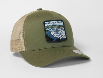 Olive green Niagara Falls trucker hat with tan mesh sides, its waterfall patch stitched across the front panel.