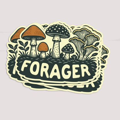 A stack of Forager Mushrooms stickers fans out on a pale grey surface, top one facing forward.