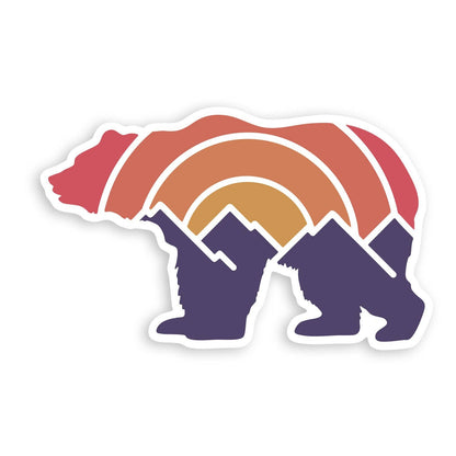 The Adventure Grizzly Bear sticker on white, its body filled with sunset arcs above purple mountain peaks.