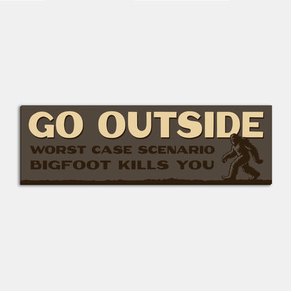 A single Go Outside Worst Case Scenario Bigfoot Kills You bumper sticker sits alone on a plain backdrop.