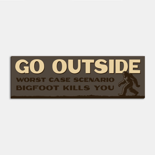 A single Go Outside Worst Case Scenario Bigfoot Kills You bumper sticker sits alone on a plain backdrop.