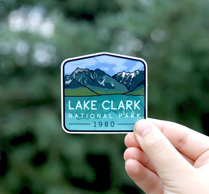 Held a little farther back, the Lake Clark National Park sticker shows its 1980 date and teal water panel.