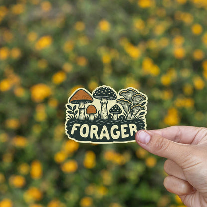 Yellow blooms fill the background as a hand tilts the Forager Mushrooms sticker toward the camera.