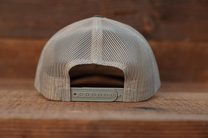 Back of the olive Olympic National Park trucker hat, tan mesh and a row of snap holes above brown wood.