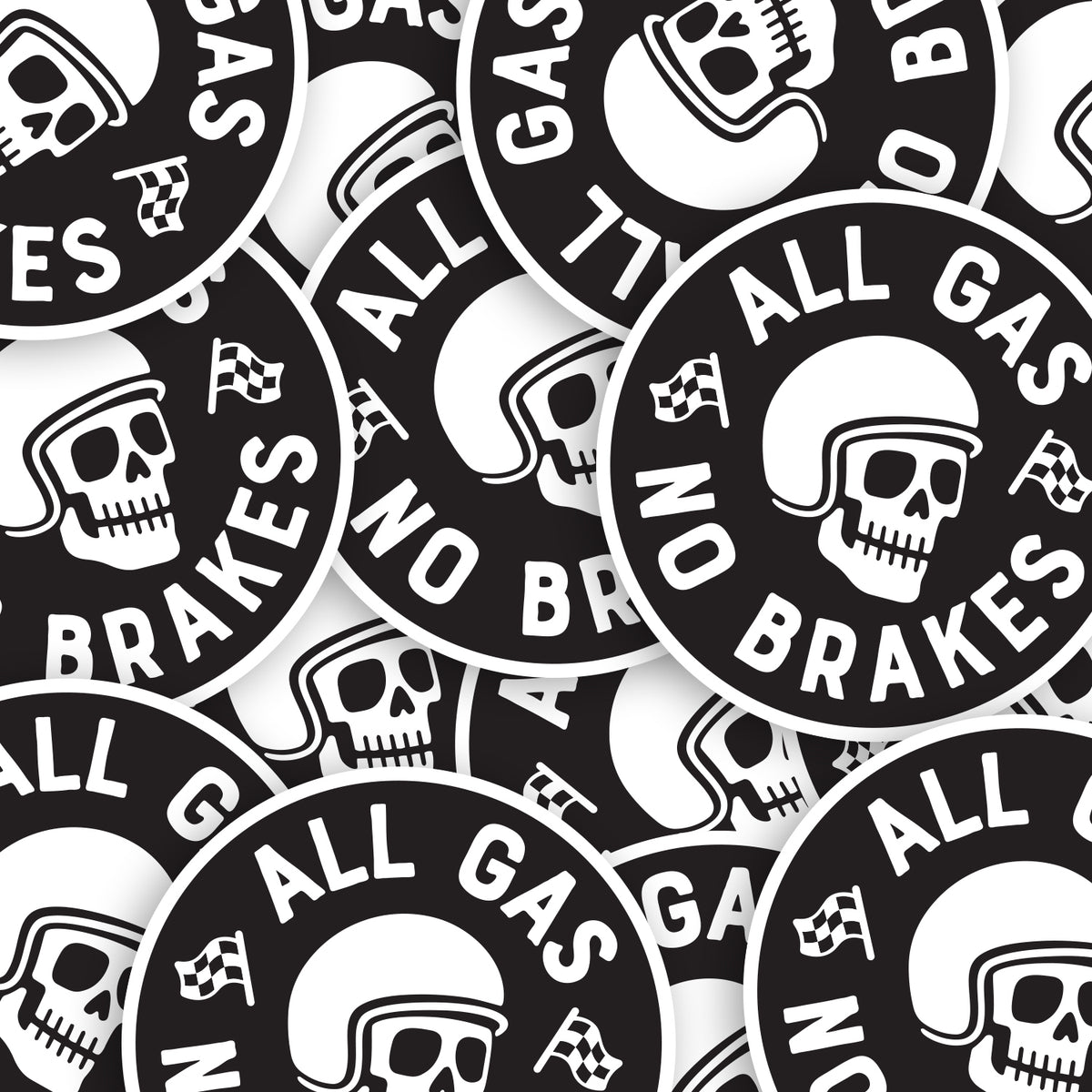 About a dozen All Gas No Brakes stickers overlap in a tight pile, each one showing the same helmeted skull design.