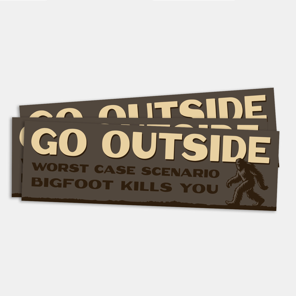 Two Go Outside Worst Case Scenario Bigfoot Kills You bumper stickers overlap slightly against a plain grey background.