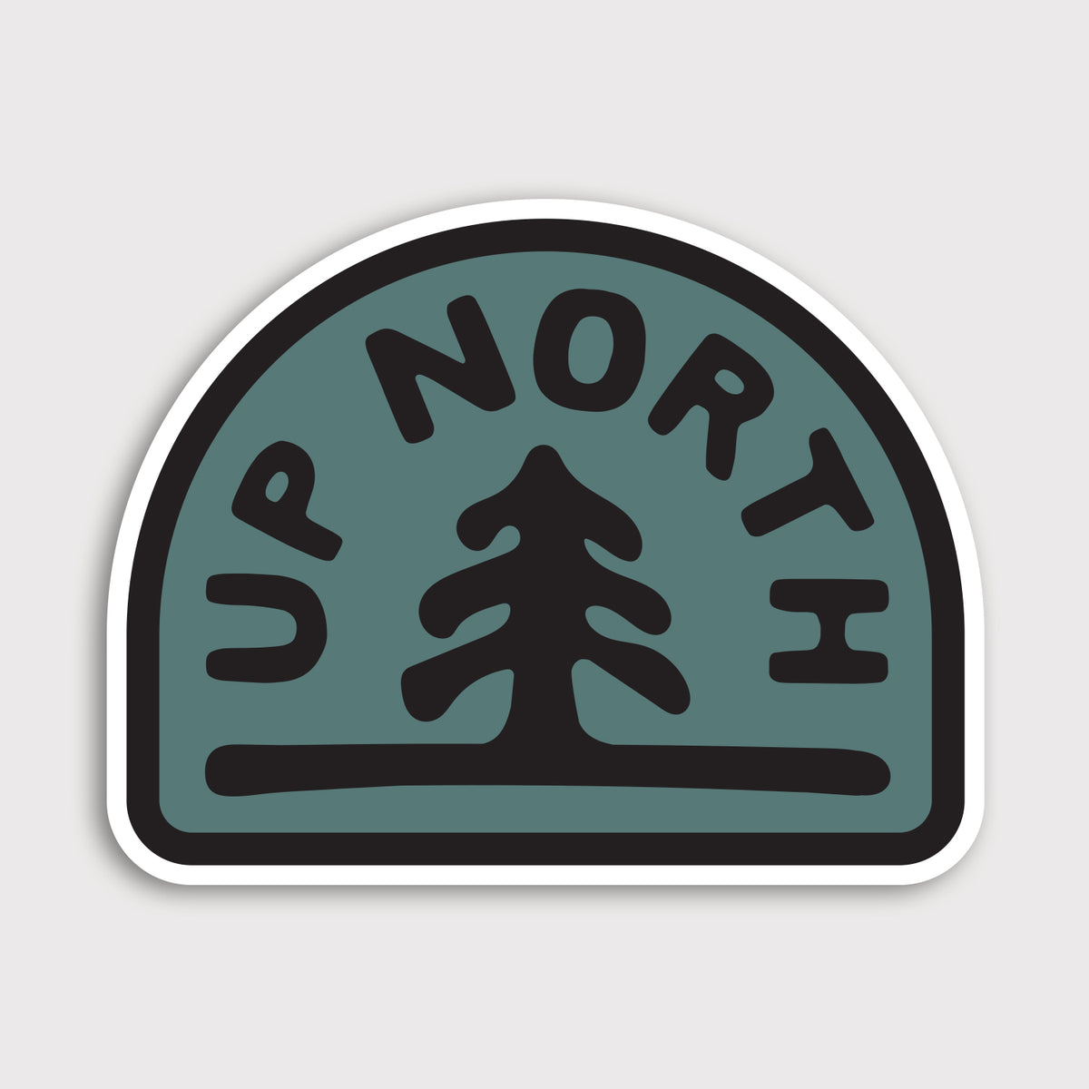 The Up North sticker shows a single pine tree and arched lettering in black on a teal badge shape.
