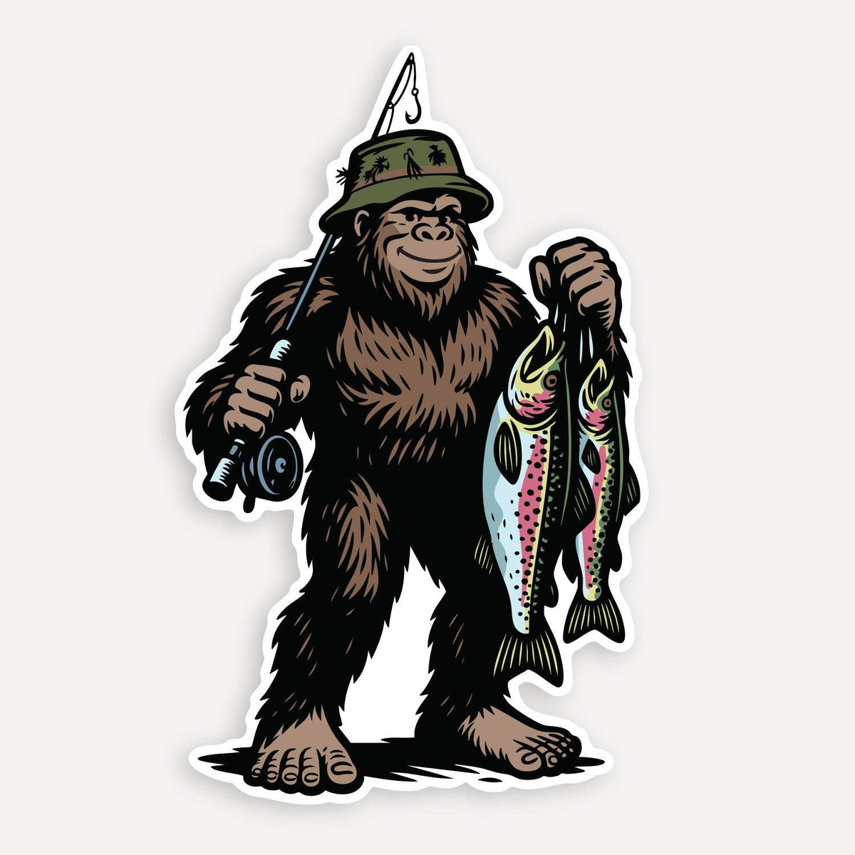 Bigfoot Fishing sticker on a plain grey backdrop, a sasquatch in a bucket hat holding a rod and two trout.
