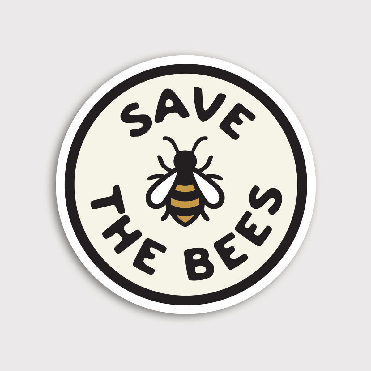 A round Save The Bees sticker shows a bee illustration between bold lettering on a cream circle with white border.