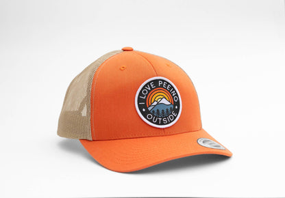 Bright orange crown and tan mesh carry the I Love Peeing Outside patch above a curved orange brim.