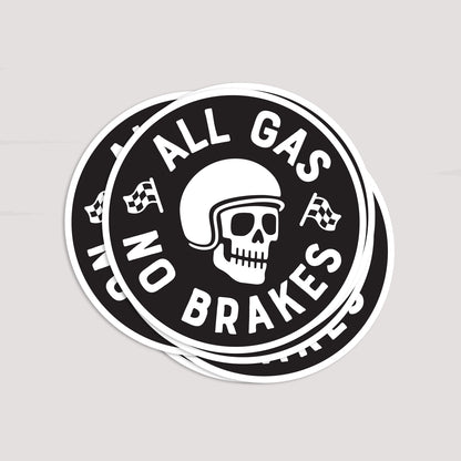 A small stack of All Gas No Brakes stickers sits slightly offset, their white borders layered against pale grey.