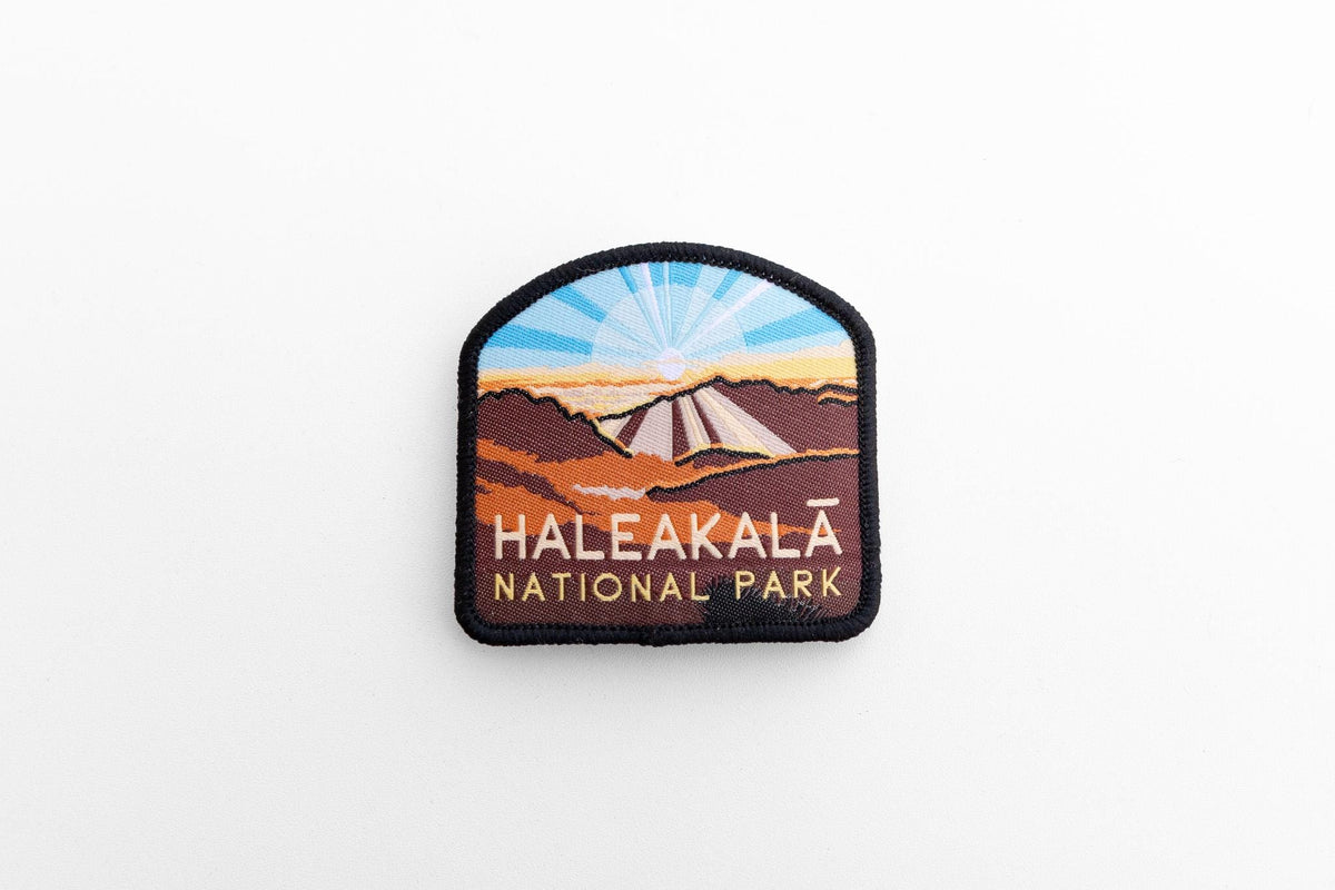 Shot from farther back, the small Haleakala National Park patch sits alone on a plain white surface.