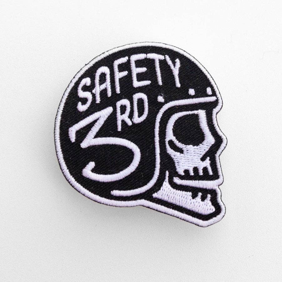 Filling the frame on white, the Safety 3rd Helmet Patch shows a white stitched skull in a black helmet.