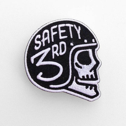 Filling the frame on white, the Safety 3rd Helmet Patch shows a white stitched skull in a black helmet.