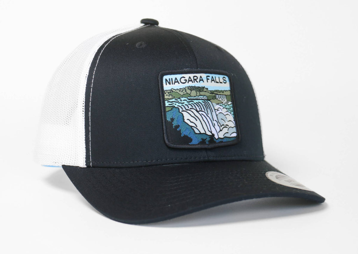 Black Niagara Falls trucker hat with white mesh sides, the patch showing blue water over a rocky ledge.