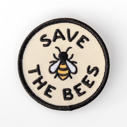 Centered on a plain white background, the Save The Bees patch shows its embroidered bee in gold, white and black.