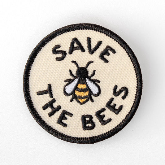 Centered on a plain white background, the Save The Bees patch shows its embroidered bee in gold, white and black.