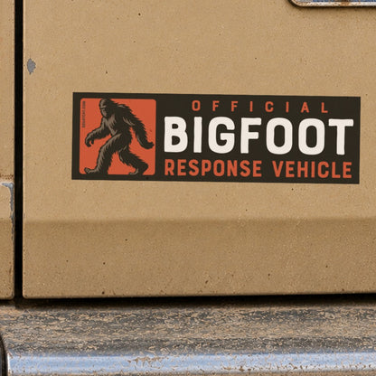 Stuck above the bumper of a dusty tan truck, the Bigfoot Response Vehicle sticker sits beside a Tennessee plate.