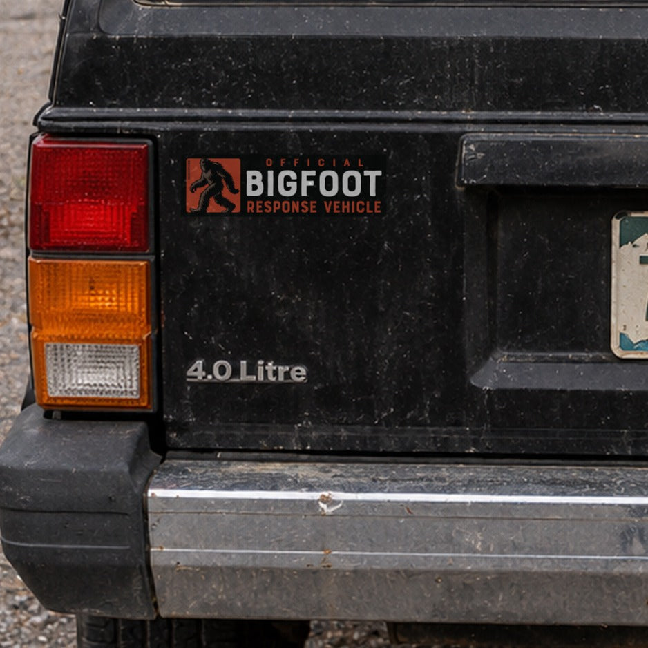 On a black Jeep Cherokee's hatch, the Bigfoot Response Vehicle sticker sits near a Montana plate and roof decal.