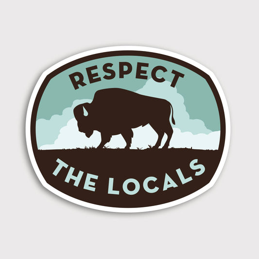 A brown bison grazes under teal clouds on the Respect The Locals Bison sticker against a plain grey backdrop.