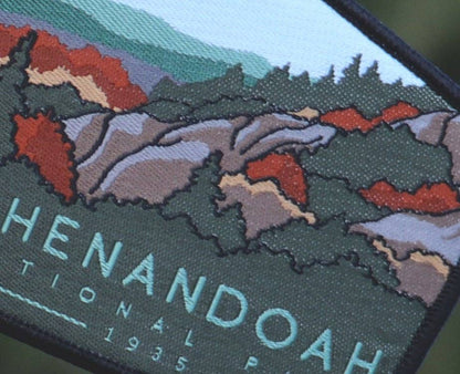 Close in on the stitching, red foliage and green ridges fill the Shenandoah National Park patch.