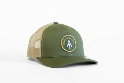 Angled on white, the olive Appalachian Trail trucker hat shows its Maine to Georgia patch beside khaki mesh.
