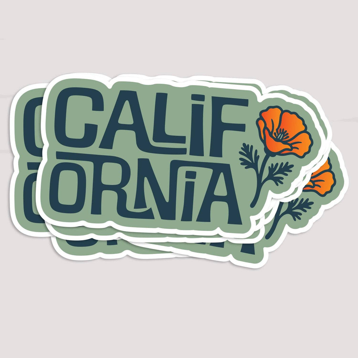 Several California Poppy stickers fanned in a stack on a pale grey surface, orange blooms overlapping.