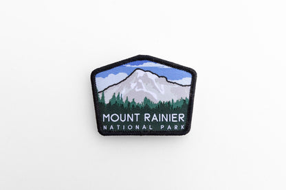 Small in a wide white frame, the Mount Rainier National Park patch shows its full five sided shape.