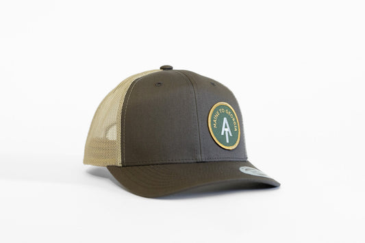 Brown and tan AT Maine to Georgia trucker hat angled on white, patch sitting left of the front seam.