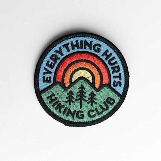 Close and straight on, the Everything Hurts Hiking Club patch shows every stitch in its black merrowed border.