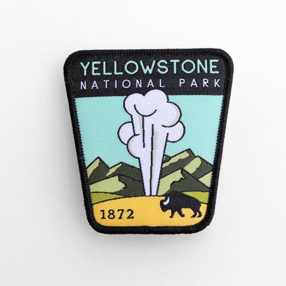 On a plain white background, the Yellowstone National Park patch shows a geyser, mountains and a bison.