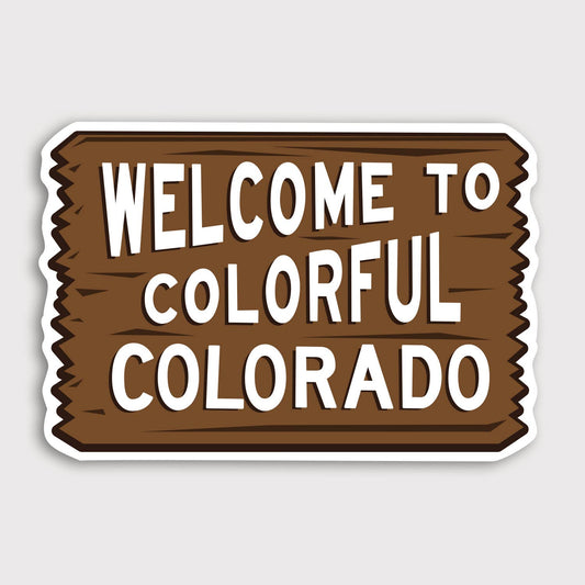 Brown wooden sign artwork fills the Welcome to Colorful Colorado sticker on a plain grey background.