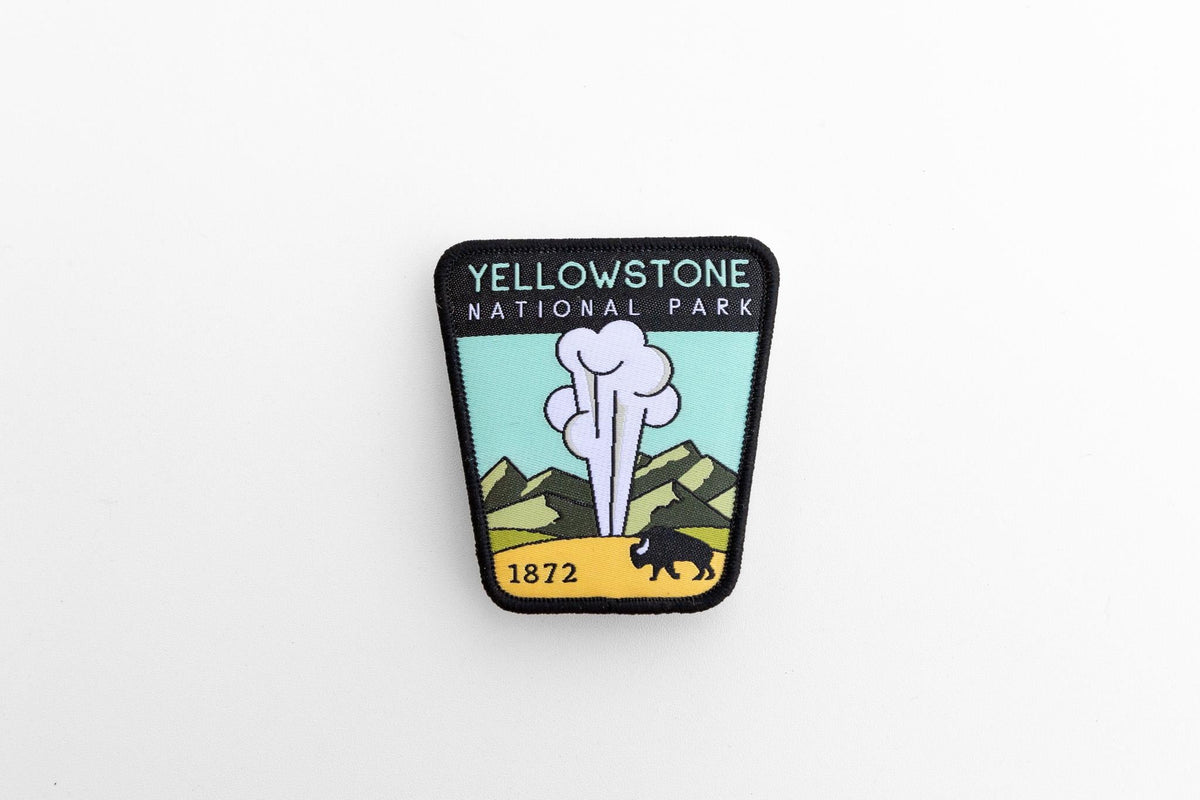 Set small and centered on white, the Yellowstone National Park patch keeps its black stitched border crisp.