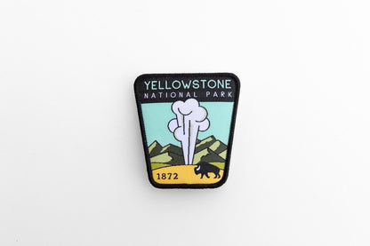 Set small and centered on white, the Yellowstone National Park patch keeps its black stitched border crisp.