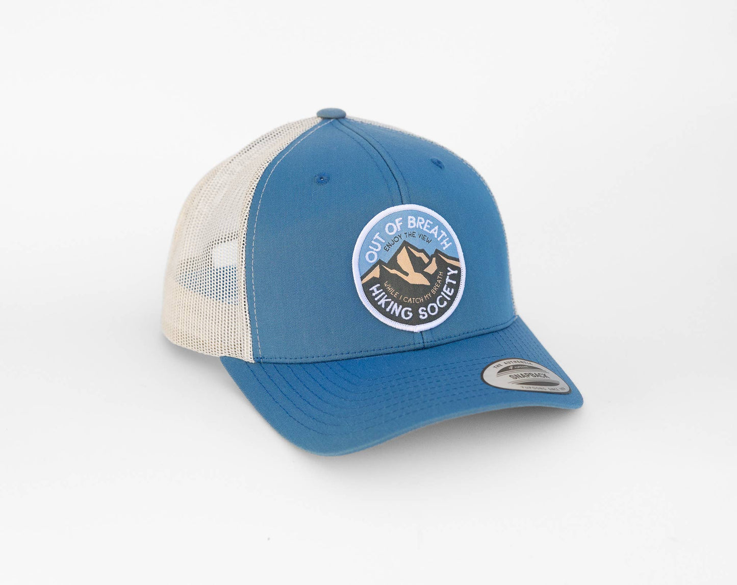 Steel blue front and stone mesh on the Out of Breath Hiking Society trucker hat, patch facing the camera.