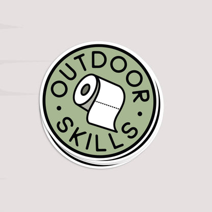 A short stack of Outdoor Skills stickers rests on a pale grey surface, top one facing up.