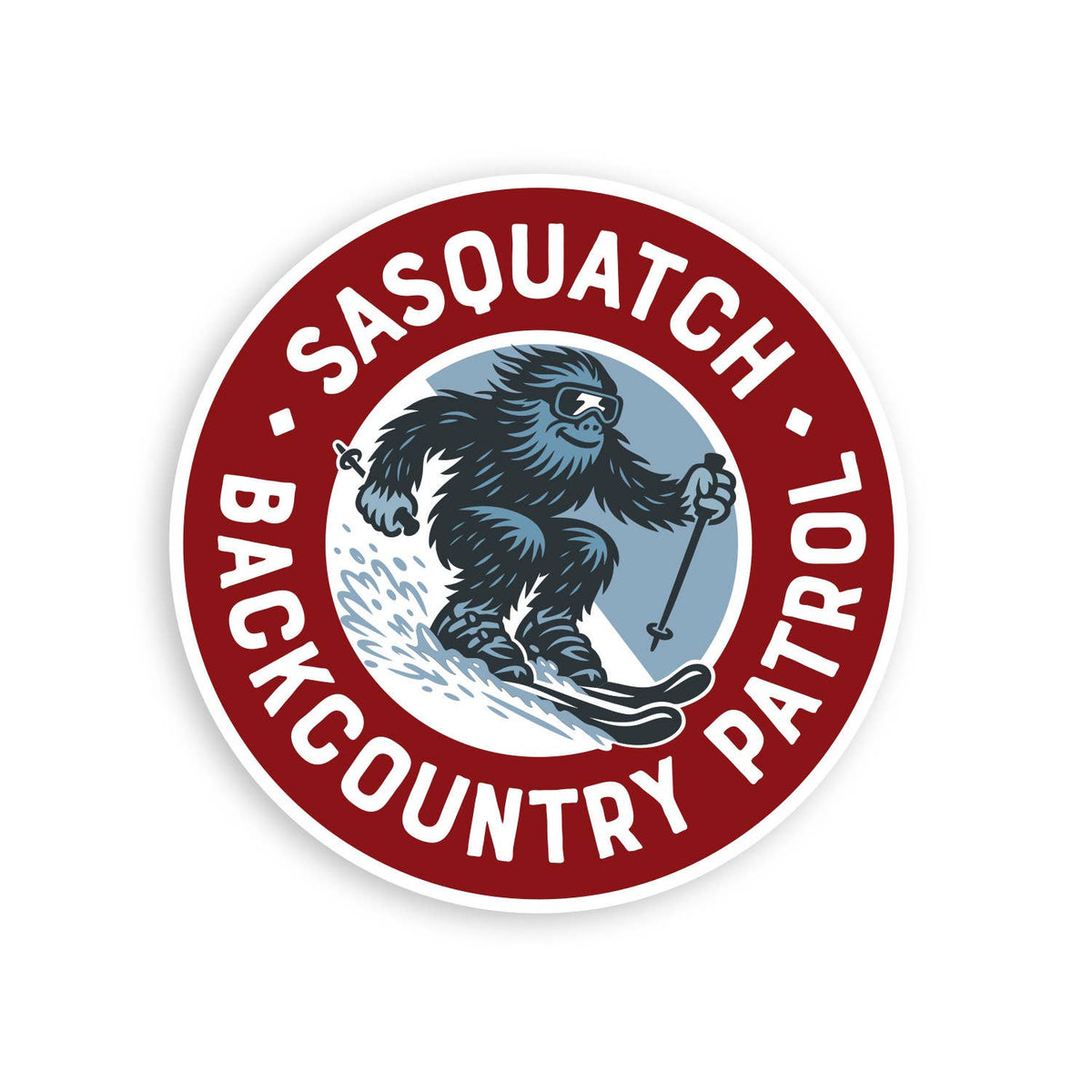 Round red Sasquatch Backcountry Patrol sticker with a skiing bigfoot in goggles ringed by white lettering.
