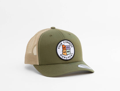 Olive crown with tan mesh, the Four Corners Monument trucker hat shows UT, CO, AZ and NM on a white circle patch.