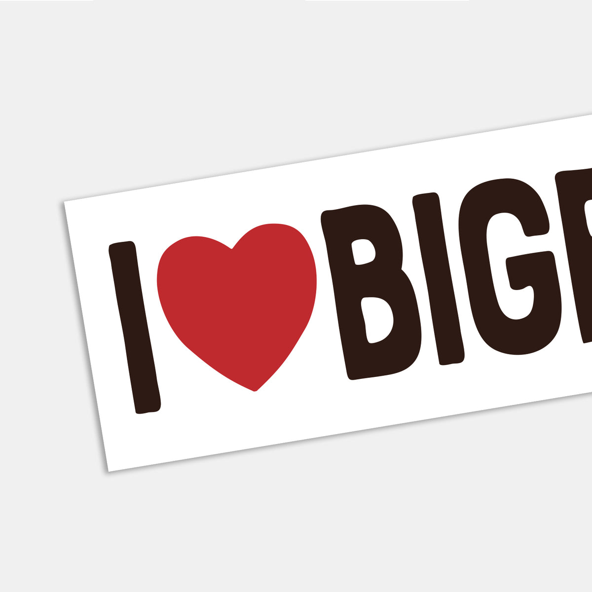 Angled across the frame, the I Heart Bigfoot sticker shows its red heart beside bold letters cut off at the edge.