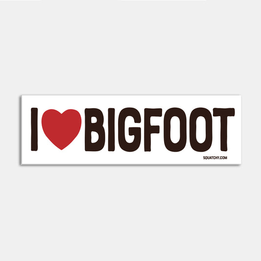 A single I Heart Bigfoot bumper sticker sits flat against a plain grey background with its red heart and black text visible.